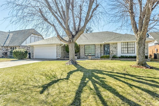 view of front of home featuring driveway, a shingled roof, a front yard, an attached garage, and brick siding