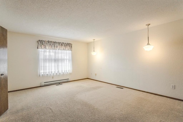 carpeted empty room with a textured ceiling, baseboards, visible vents, and a baseboard radiator