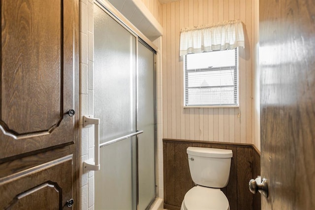 full bathroom with an enclosed shower and toilet