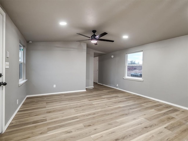 unfurnished room with a ceiling fan, baseboards, recessed lighting, vaulted ceiling, and light wood-type flooring