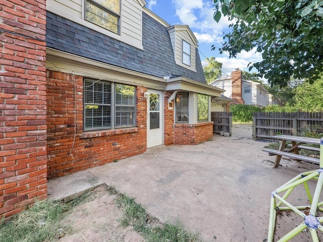 view of patio featuring fence