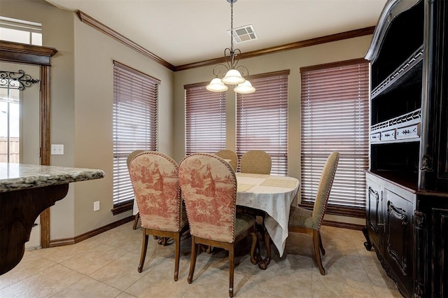 dining room featuring crown molding, light tile patterned flooring, baseboards, and visible vents