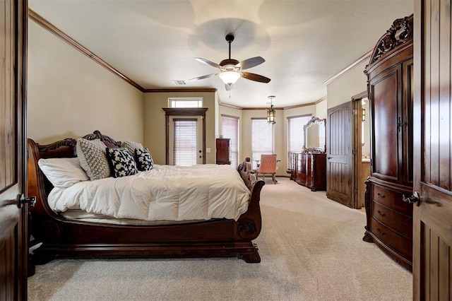 bedroom with crown molding, light colored carpet, visible vents, and ceiling fan