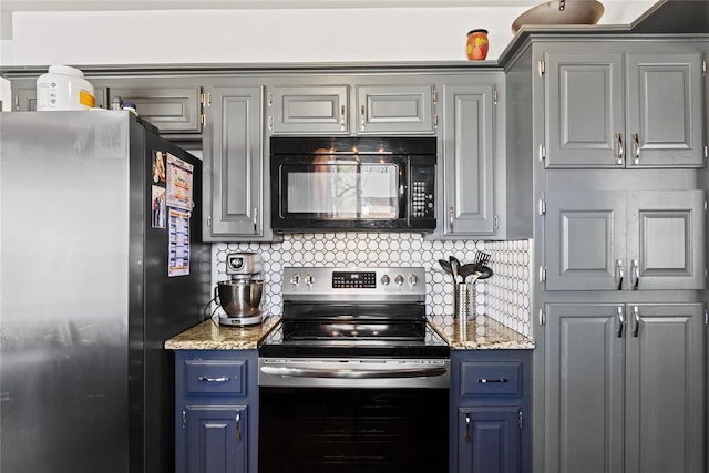 kitchen featuring blue cabinetry, gray cabinets, tasteful backsplash, and stainless steel appliances