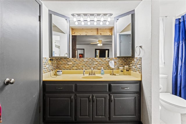 full bathroom featuring decorative backsplash, toilet, vanity, and ceiling fan