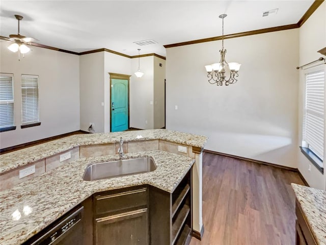 kitchen featuring stainless steel dishwasher, crown molding, wood finished floors, and a sink