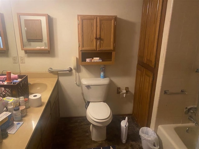 bathroom featuring baseboards, toilet, and vanity