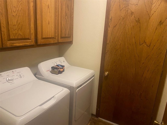 laundry area featuring cabinet space and washer and dryer