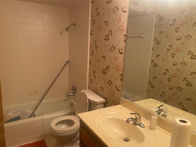 full bath featuring toilet, tub / shower combination, wallpapered walls, and vanity