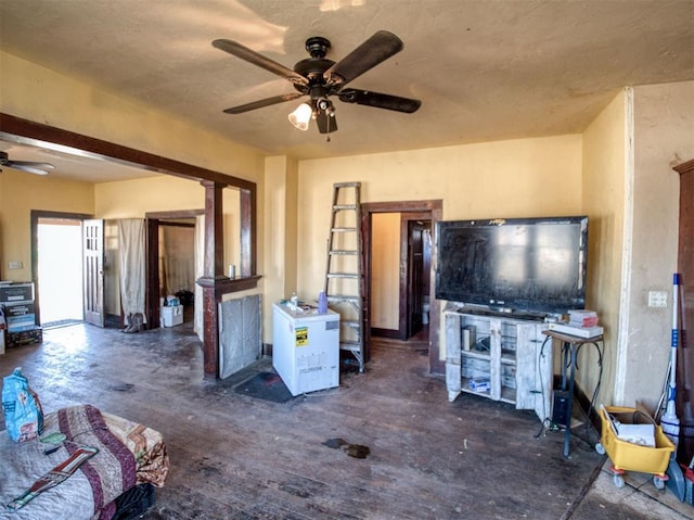 unfurnished living room featuring ceiling fan