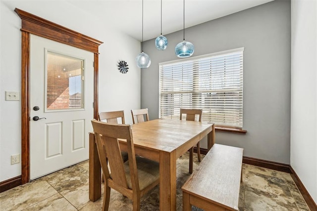 dining space featuring baseboards