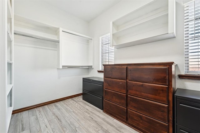 spacious closet with light wood-style floors