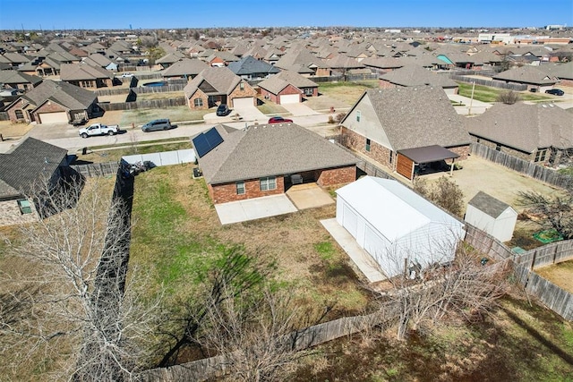 birds eye view of property with a residential view