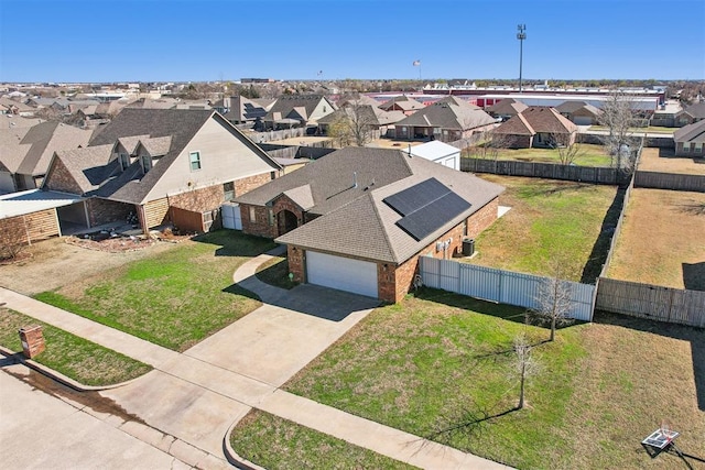 birds eye view of property with a residential view