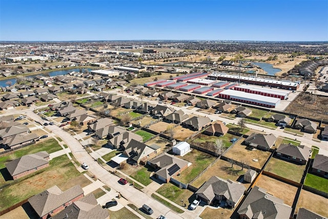 bird's eye view with a water view and a residential view