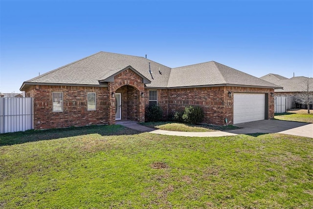 view of front of property with fence, driveway, an attached garage, a front lawn, and brick siding