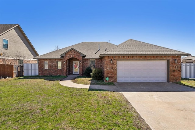 ranch-style house with brick siding, a shingled roof, a front yard, and fence