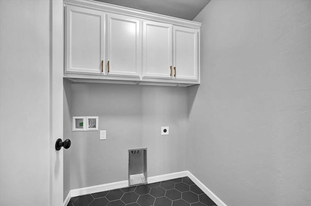 clothes washing area featuring cabinet space, hookup for an electric dryer, baseboards, and washer hookup