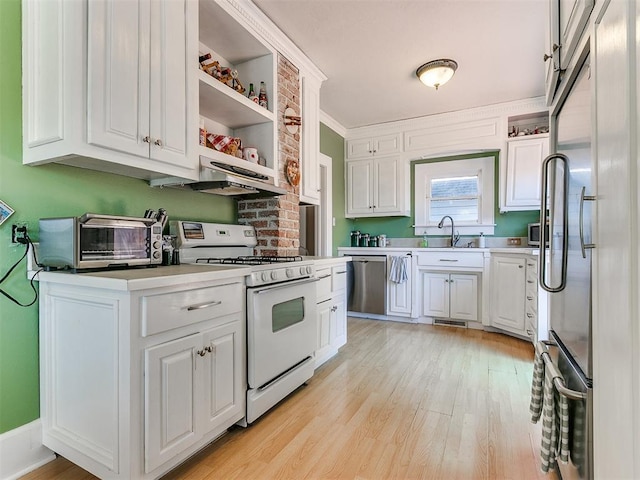 kitchen with white cabinetry, light countertops, and appliances with stainless steel finishes