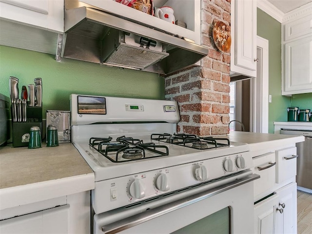 kitchen featuring dishwasher, light countertops, white gas range oven, exhaust hood, and white cabinetry