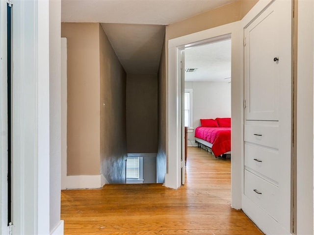 hallway with visible vents and light wood-type flooring