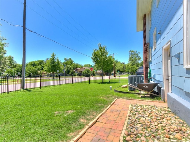 view of yard with cooling unit and fence