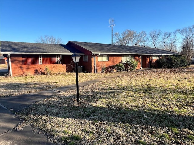 view of side of home featuring brick siding