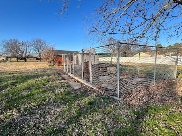 view of yard with an outbuilding and fence