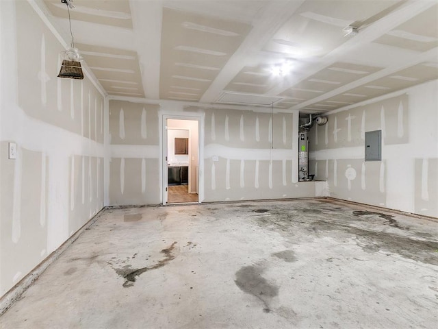 garage featuring electric panel and water heater