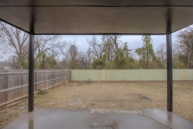 view of yard featuring a patio area and a fenced backyard