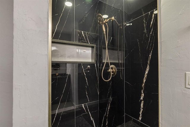 room details with a marble finish shower