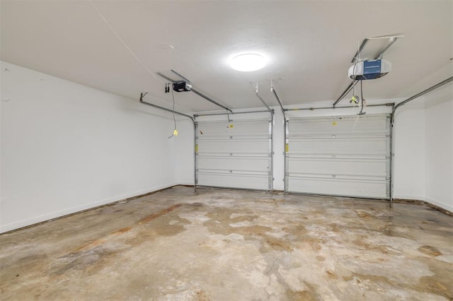 2418 NW 43rd Cir, Oklahoma City, OK 73112 - garage with baseboards and a garage door opener