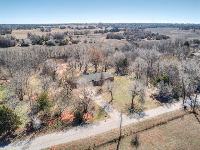 birds eye view of property with a rural view