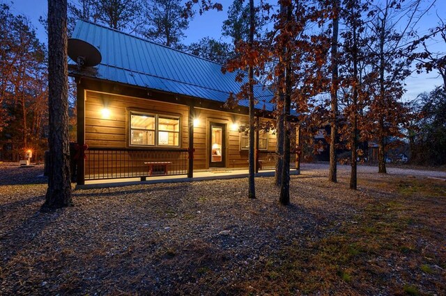 view of front of home with metal roof and covered porch