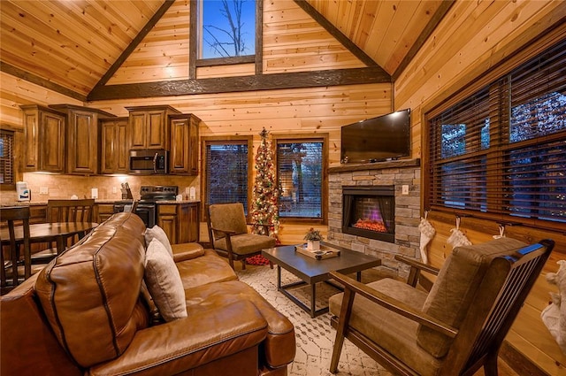 living room featuring high vaulted ceiling, wooden walls, wood ceiling, and a fireplace