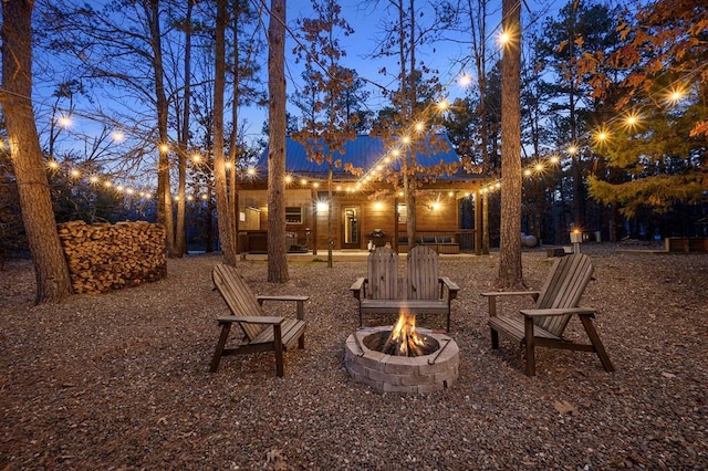 view of yard with an outdoor fire pit