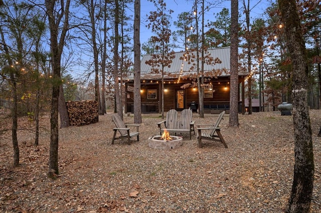 view of yard with an outdoor fire pit