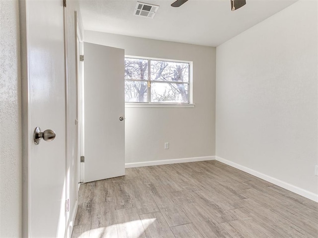 unfurnished bedroom with baseboards, visible vents, light wood finished floors, and ceiling fan