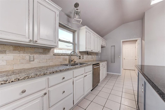 kitchen with dishwasher, vaulted ceiling, light tile patterned flooring, white cabinetry, and a sink