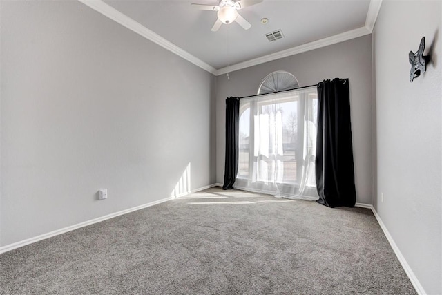 carpeted empty room featuring visible vents, ceiling fan, crown molding, and baseboards