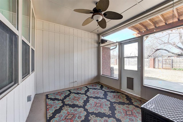 sunroom with a ceiling fan