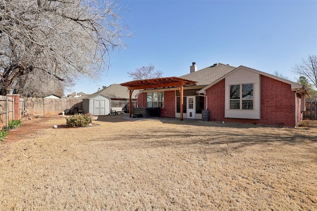 back of house with an outbuilding, a shed, a fenced backyard, a pergola, and brick siding