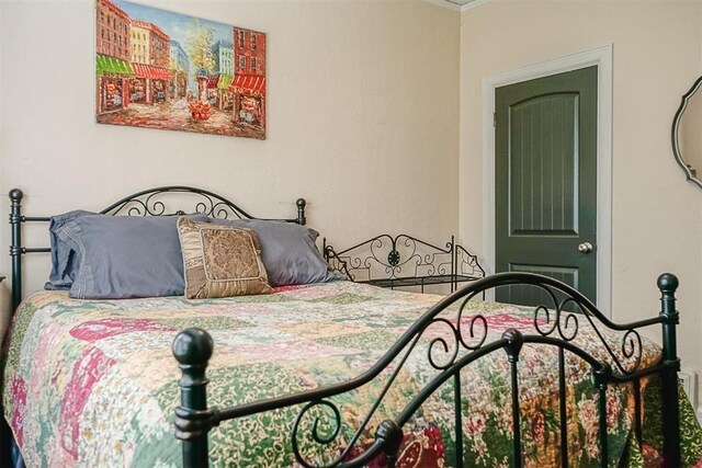 bedroom with crown molding