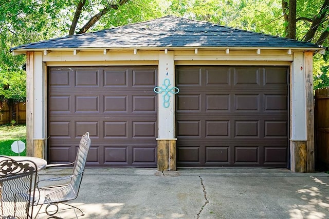 detached garage with fence
