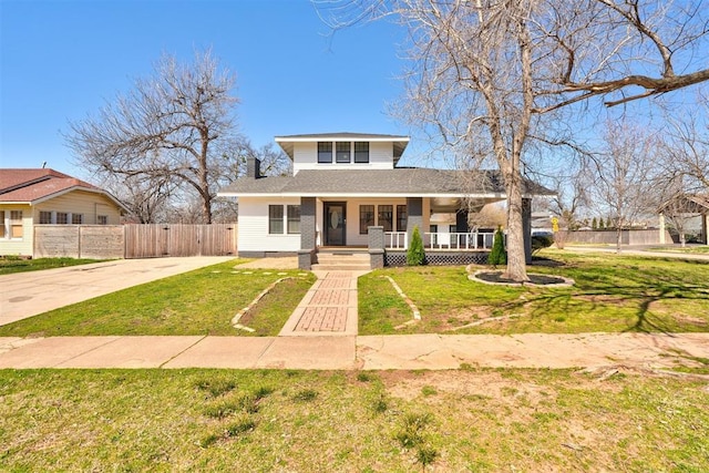 bungalow featuring a front lawn, fence, covered porch, concrete driveway, and crawl space