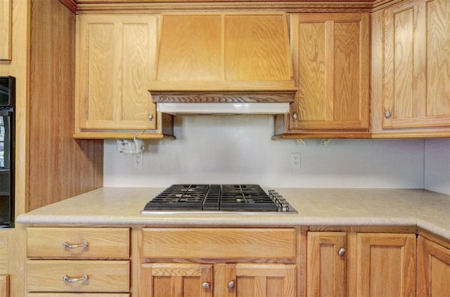 kitchen with light countertops and stainless steel gas cooktop