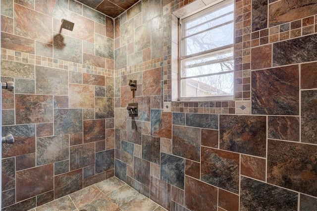 full bathroom featuring tiled shower