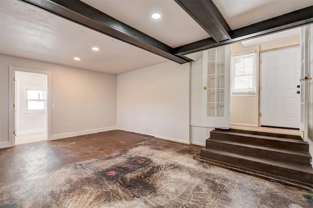 basement with recessed lighting and baseboards