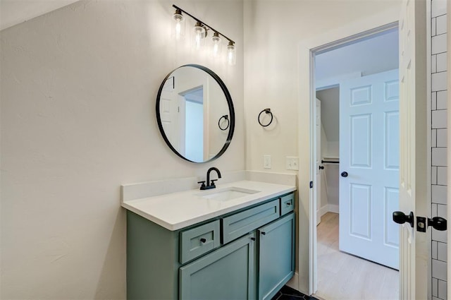 bathroom featuring vanity and wood finished floors