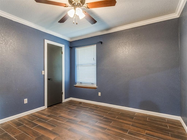 spare room featuring baseboards, crown molding, wood tiled floor, and a textured wall